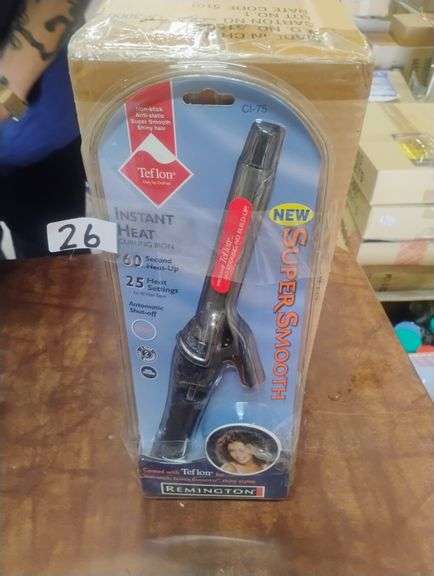 Remington Instant Heat Curling Iron CI-75. This curling iron features a Teflon-coated barrel designed to create non-stick, super smooth, and shiny hair styles with rapid heat-up and multiple temperature settings. - $22.00