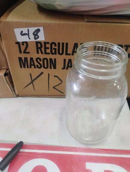 Regular Mouth Mason Jar. A clear glass jar designed for canning, food preservation, and general storage. - $2.50