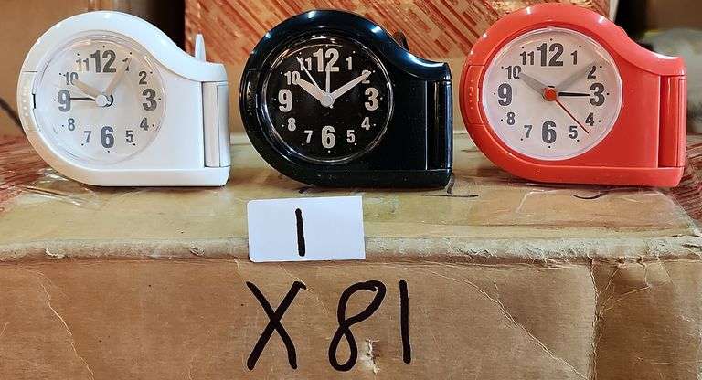 Mini Travel Alarm Clock. This compact analog clock is designed for portability and features an alarm function for travel or bedside use. - $7.00