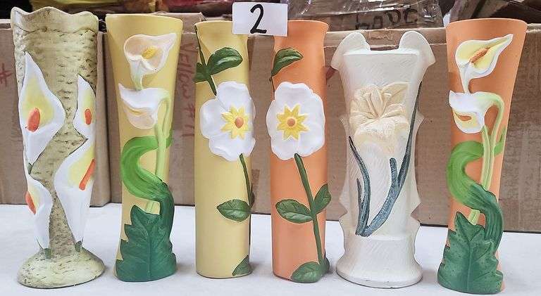 Decorative Ceramic Floral Vase  ThESE  decorative ceramic vaseS showcases various embossed floral patterns and colors, designed to enhance home decor or hold fresh flowers. - $10.00