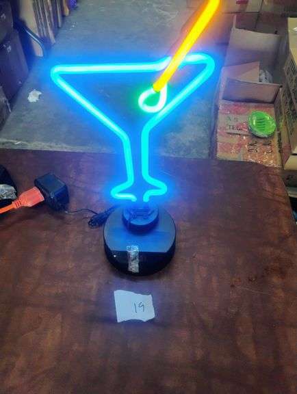 Martini Glass LED Neon Table Sign. This LED neon sign features a vibrant martini glass design with a blue glass, yellow straw, and green olive, perfect for decorative lighting. - $45.00