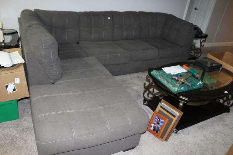 DARK GREY WITH STITCHING SECTIONAL SOFA  EST. 1500.00