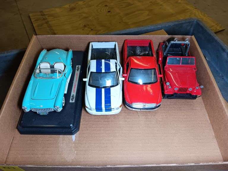 Model Jeep, Chevrolet Corvette 1957 Model Car on Stand, Dodge Ram Scale 1/26, and Dodge Ram Model Tr