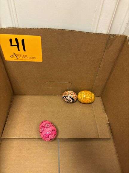 Decorated Pysanky egg (1) and wooden eggs (2)