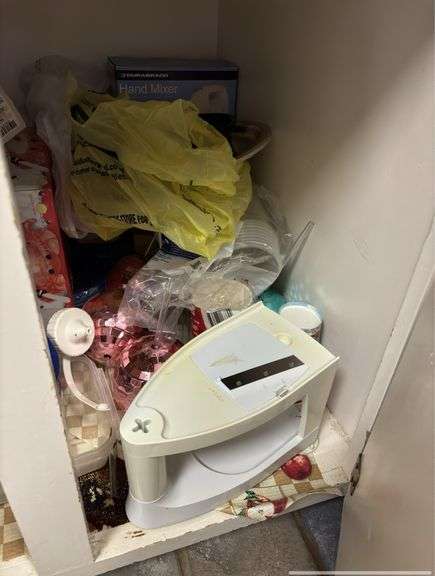 Cabinet full of items. Cabinet not included.