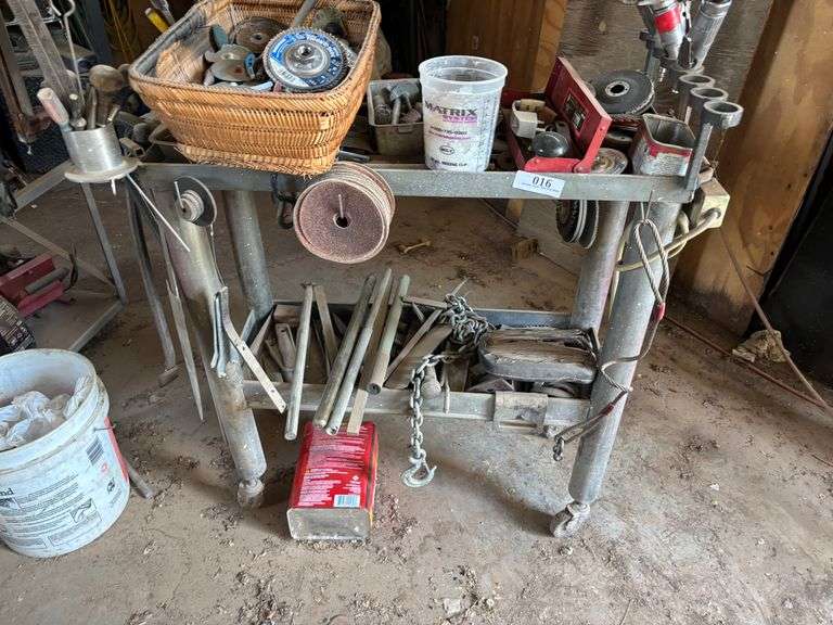 Shop table with crowbars grinding disc ect