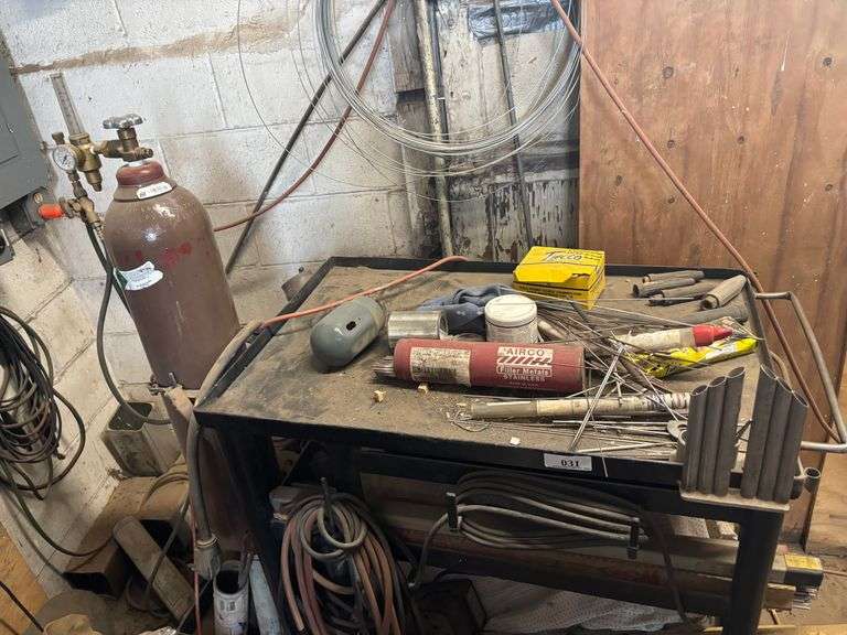 Shop table with crowbars grinding disc ect