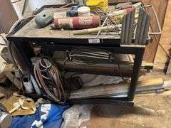 Shop table with crowbars grinding disc ect