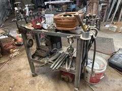 Shop table with crowbars grinding disc ect