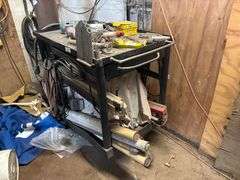 Shop table with crowbars grinding disc ect