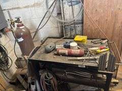 Shop table with crowbars grinding disc ect