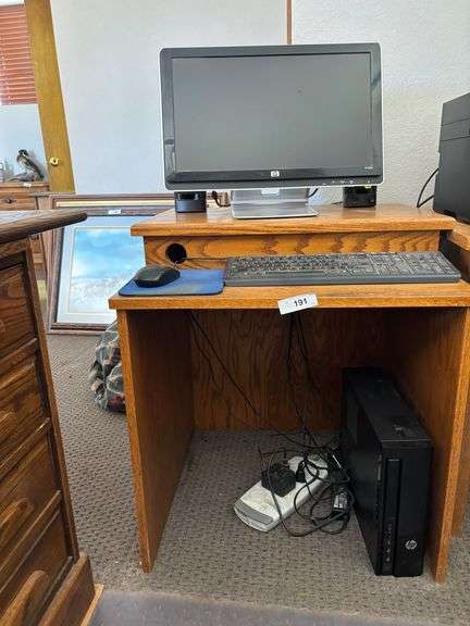 Desk with computer monitor keyboard mouse