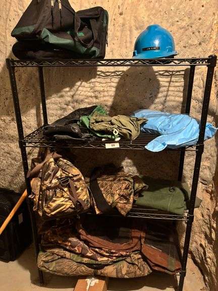 Metal rack with bags, helmet clothing