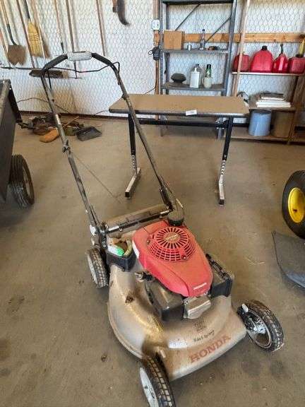 Table with Honda lawn mower
