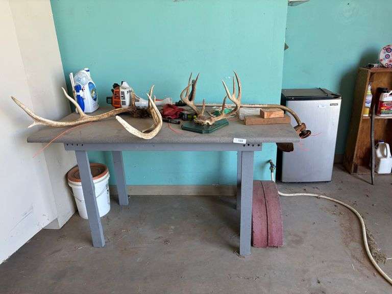 Table with antlers head mount misc