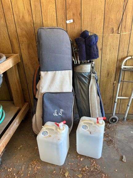 2 water holders and 2 golf club holders with clubs