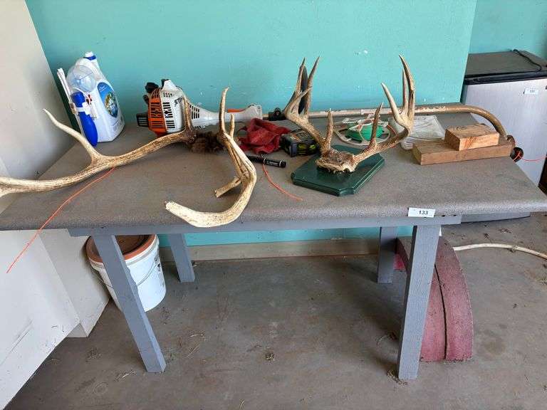 Table with antlers head mount misc