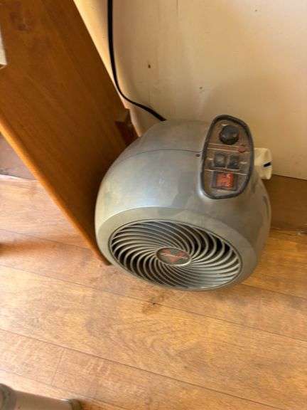 Table with chair, sign with fan