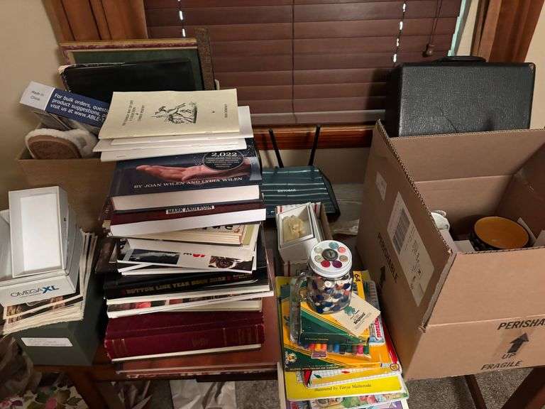 Empty boxes , books, coloring with books , jars, buttons, table, net gear router misc