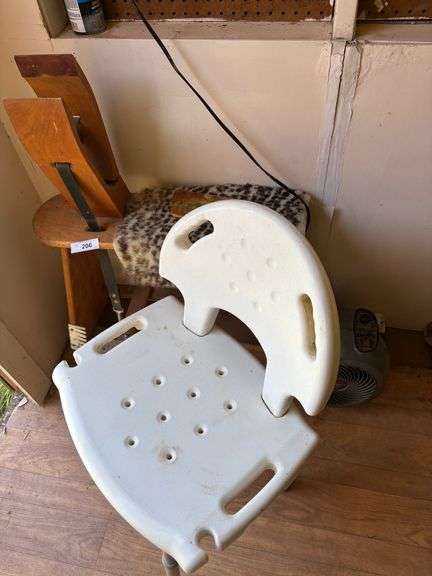 Table with chair, sign with fan