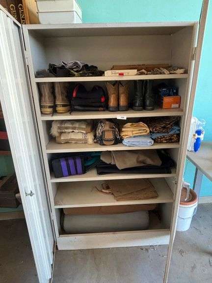 Cabinet with boots, retriever dummy's clothers misc