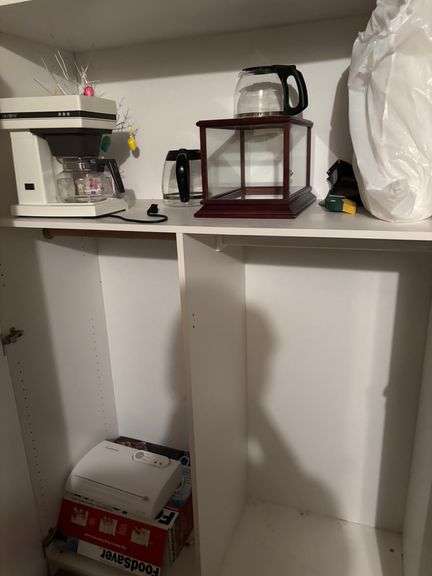 Filing cabinet, coffee mugs, coffee maker, misc decor
