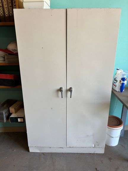 Cabinet with boots, retriever dummy's clothers misc