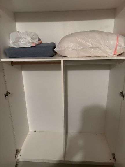 Cabinet with pillows, and blankets