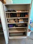 Cabinet with boots, retriever dummy's clothers misc