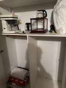 Filing cabinet, coffee mugs, coffee maker, misc decor