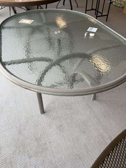 64x42 inch glass top wrought iron table