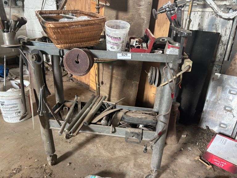 Table with crowbars ,tools, misc