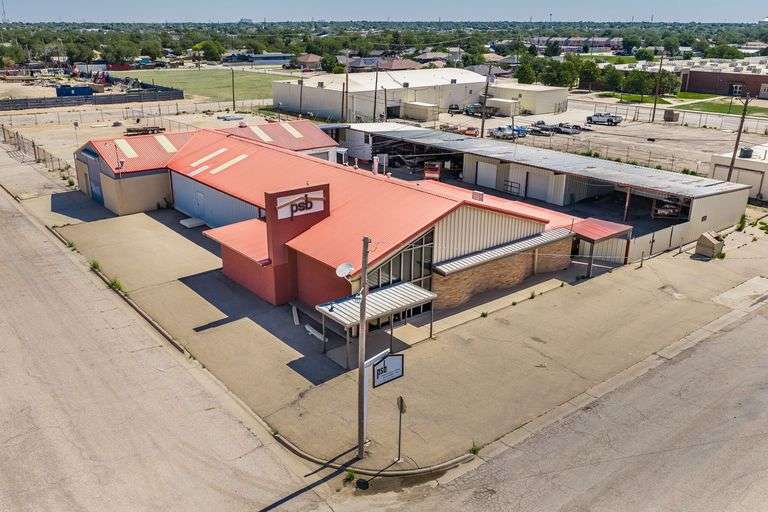 Commercial office and warehouse building listed in a current Assiter Auctioneers real estate auction