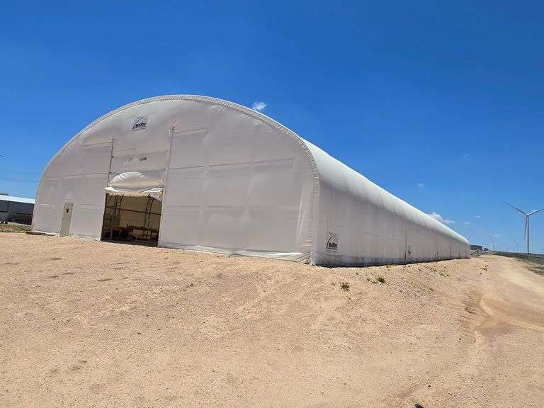 A 300 by 70 foot Big Top portable structure being sold as surplus in a current Assiter Auctioneers personal property auction