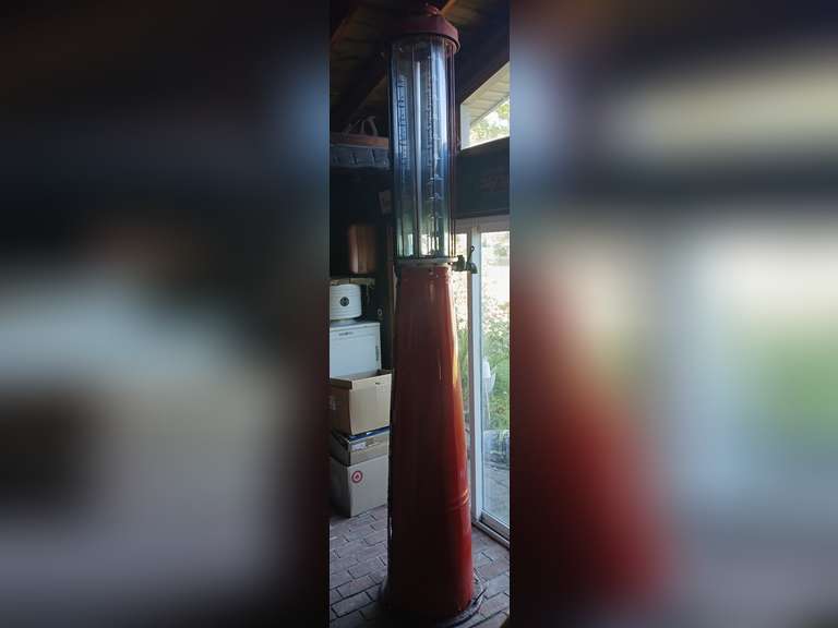 11' Gilbert & Barker model T-176-109 Gas pump. Featuring a blue tint glass display from the early 1900's. Customer States Pump was used at Petens machine shop and was restored after purchase. Paint peeling on one side.