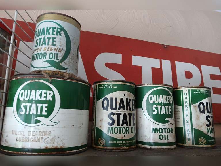 Quaker State advertising motor oil, lubricant metal cans