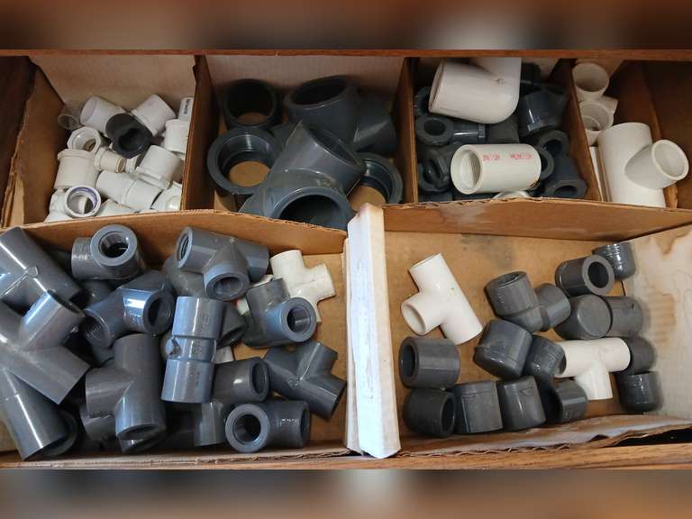 Assortment of pvc 2" couplers, 1/2" caps, 1/2" tees, 3/4" x 1 1/2" bushings and more