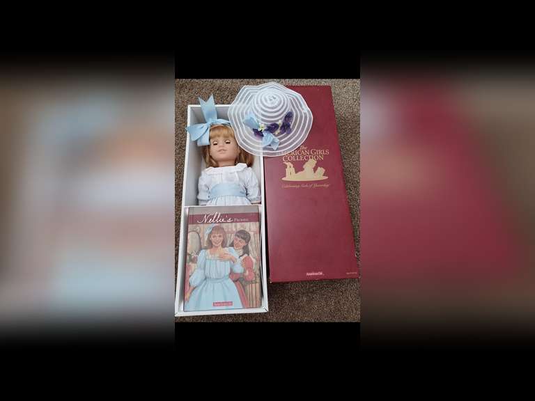 Nellie O’Malley. Nellie is an original American Girl Doll. She is the best friend and an adopted sister to Samantha Parkington. Nellie stands 18 inches tall and wears her original period clothing. Nellie has been displayed behind glass in a smoke-free environment, and she has not been used for play. Nellie comes with all her accessories including her book, “Nellie’s Promise” in her original box. Her doll stand is packed separately.