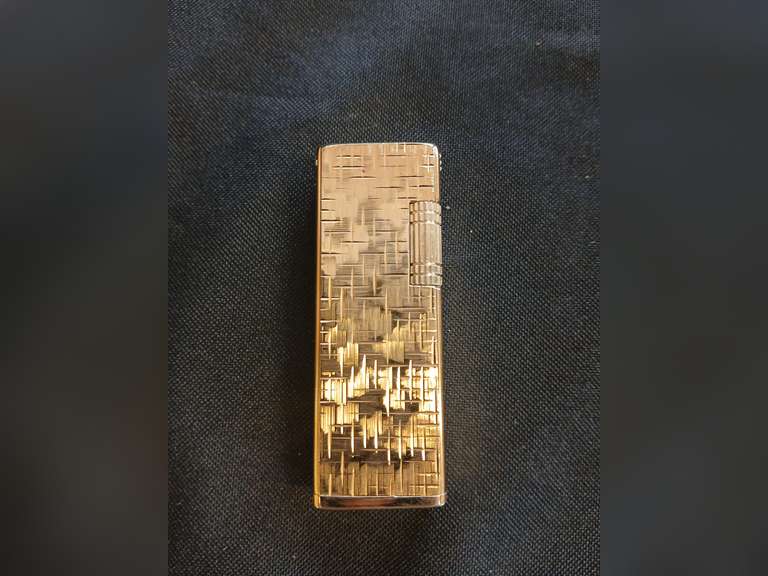 Five Star brass lighter with gold geometric accents.