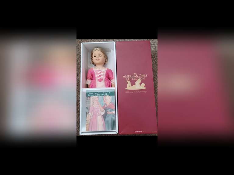 Elizabeth Cole. Elizabeth is an original American Girl doll. She is the second released “Best Friend” and is the best friend of Felicity Merriman. She was the second doll released in the Best Friend line in 2005. She stands 18 inches tall and wears her original period clothing. Elizabeth has been displayed behind glass in a smoke-free environment, and she has not been used for play.
Elizabeth comes with her book, “VERY FUNNY, Elizabeth!” along with her other accessories packed in the original box. Her doll stand and NEW hair ribbon, and “gold” earrings are packed in a second box.
