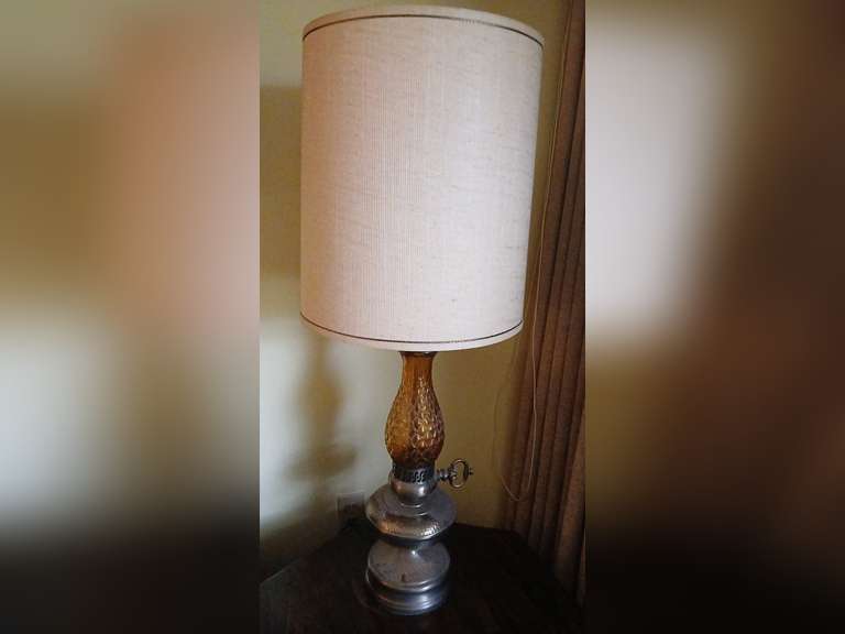 Pair amber glass table lamps with hammered brass base, 38" H