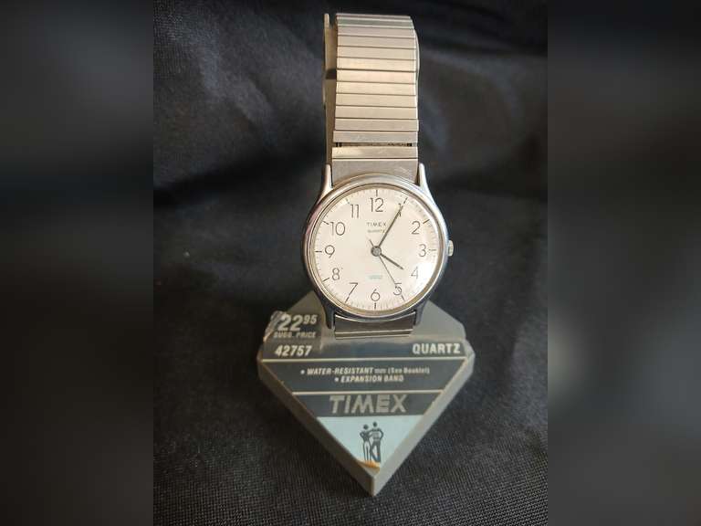 Timex Quartz wristwatch on advertising stand