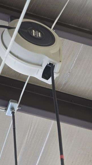 Hose reel, suspended from ceiling.  Aprox 16ft to ceiling