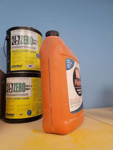 24/70 v o c, two cans, and one bottle of floetrol on top of number 58 yellow cabinet,No other conten