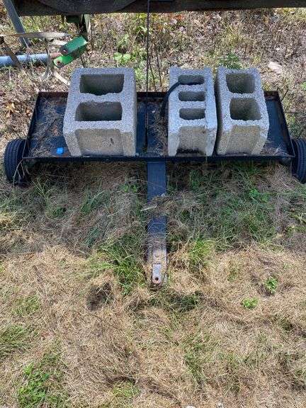 Metal Utility Cart with Three Concrete Blocks