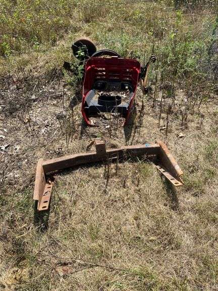 Used Tractor Hitch and Red Body Panel Components