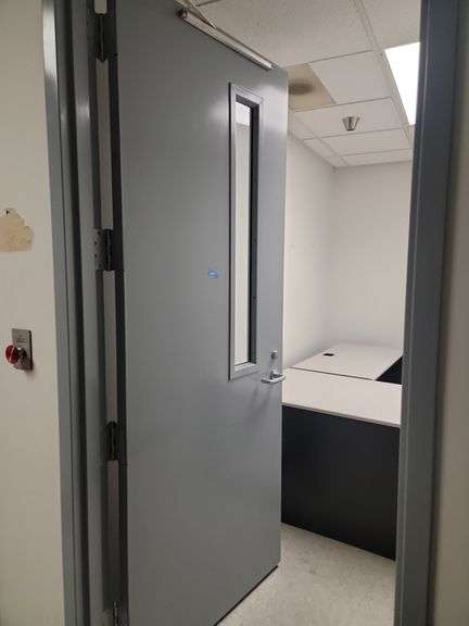 7 ft x 3 ft steel door with small window purchaser will need to remove