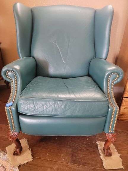 Turquoise  winged back recliner chair upstairs room