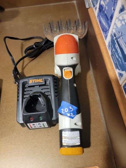 Stihl grass/shrub trimmer with charger and battery