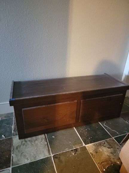 Brown storage cabinet in hall in basement